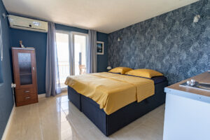 Studio Nilan Croatia – bedroom with double boxspring bed